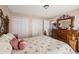 Bedroom with double closet and wood dresser at 4704 Town N Country Blvd, Tampa, FL 33615