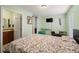 Spacious bedroom with ensuite bathroom and built-in shelving at 4704 Town N Country Blvd, Tampa, FL 33615