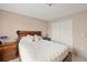 Bedroom with wood bed frame and double door closet at 4704 Town N Country Blvd, Tampa, FL 33615