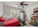 Comfortable bedroom with daybed, small work area and large window at 4704 Town N Country Blvd, Tampa, FL 33615