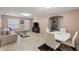 Dining area with white table, chairs, and kitchen view at 4704 Town N Country Blvd, Tampa, FL 33615