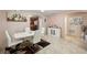 Dining area adjacent to kitchen, featuring white table and chairs at 4704 Town N Country Blvd, Tampa, FL 33615
