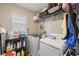 Laundry room with washer, dryer, and shelving at 4704 Town N Country Blvd, Tampa, FL 33615