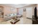 Living room featuring L-shaped sofa and coffee table at 4704 Town N Country Blvd, Tampa, FL 33615