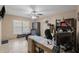 Home office with desk, chair, and ceiling fan at 4704 Town N Country Blvd, Tampa, FL 33615
