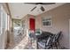 Outdoor patio dining area with table and chairs on a screened porch at 4704 Town N Country Blvd, Tampa, FL 33615