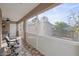 Relaxing screened porch with patio furniture and view of backyard at 4704 Town N Country Blvd, Tampa, FL 33615