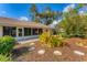 Backyard patio with planted flowerbeds and a spacious lawn at 5607 Garden Lakes Majestic, Bradenton, FL 34203