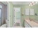 Bathroom with double vanity, and view of bedroom at 5607 Garden Lakes Majestic, Bradenton, FL 34203