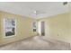 Spacious bedroom with neutral decor, ceiling fan, and ample natural light at 5607 Garden Lakes Majestic, Bradenton, FL 34203