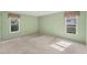 Light and airy bedroom with carpet flooring, and large windows at 5607 Garden Lakes Majestic, Bradenton, FL 34203
