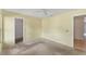 Well-lit bedroom with ceiling fan, carpet, and built-in closet at 5607 Garden Lakes Majestic, Bradenton, FL 34203