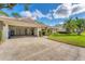 Attached garage with shelving and ample storage space at 5607 Garden Lakes Majestic, Bradenton, FL 34203