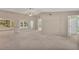 Spacious living room with high ceilings and carpet flooring at 5607 Garden Lakes Majestic, Bradenton, FL 34203