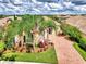 Single-Gathering home with attractive landscaping and brick driveway at 5835 Benevento Dr, Sarasota, FL 34238