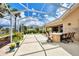 Outdoor patio with water view and screened enclosure at 5835 Benevento Dr, Sarasota, FL 34238