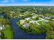 Aerial view of a waterfront house and surrounding neighborhood at 6308 Lilac Pl, Sarasota, FL 34231