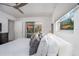 King-size bed with access to patio and pool area at 6308 Lilac Pl, Sarasota, FL 34231