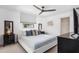 Spacious bedroom with a king-size bed, TV and plenty of natural light at 6308 Lilac Pl, Sarasota, FL 34231