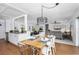 Open concept dining area with wood table and access to the backyard at 6308 Lilac Pl, Sarasota, FL 34231