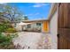 Inviting front yard with walkway, landscaping, and shade sail at 6308 Lilac Pl, Sarasota, FL 34231