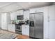 Updated kitchen featuring white cabinetry and stainless steel appliances at 6308 Lilac Pl, Sarasota, FL 34231