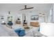 Bright living room featuring stylish furniture and large TV at 6308 Lilac Pl, Sarasota, FL 34231