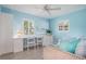 Home office with a built-in desk and seating area at 6308 Lilac Pl, Sarasota, FL 34231