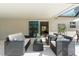 Relaxing patio with wicker furniture and shaded seating area at 6308 Lilac Pl, Sarasota, FL 34231