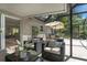 Relaxing patio furniture with view into living room and pool area at 6308 Lilac Pl, Sarasota, FL 34231