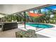 Inviting screened pool area with a large pool and ample seating at 6308 Lilac Pl, Sarasota, FL 34231