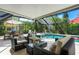 Relaxing screened pool area with seating and dining furniture at 6308 Lilac Pl, Sarasota, FL 34231