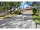 Charming single-story home featuring a tile roof, two-car garage, and meticulously maintained landscaping at 7207 Oak Moss Dr # 63, Sarasota, FL 34241