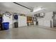 Spacious garage with epoxy floor, storage cabinets, and organized workspace at 7207 Oak Moss Dr # 63, Sarasota, FL 34241