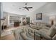 Inviting living room with wood floors, a large window, and plush seating creates a comfortable and stylish space at 7207 Oak Moss Dr # 63, Sarasota, FL 34241
