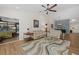 Bright living room with comfortable seating, wood floors, and natural light creates an inviting gathering space at 7207 Oak Moss Dr # 63, Sarasota, FL 34241