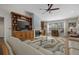 Cozy living room features a built-in entertainment center and fireplace surrounded by wood floors and neutral tones at 7207 Oak Moss Dr # 63, Sarasota, FL 34241