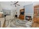 Spacious living room with a fireplace, wood floors, and an open layout offers a comfortable and stylish living space at 7207 Oak Moss Dr # 63, Sarasota, FL 34241