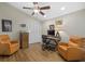 Dedicated home office featuring neutral walls, a ceiling fan, closet, and two chairs creates a perfect workspace at 7207 Oak Moss Dr # 63, Sarasota, FL 34241