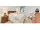Cozy bedroom with nightstand, lamps, and plush bedding offering a relaxing atmosphere at 9244 Ballaster Pointe Loop, Parrish, FL 34219