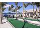 Bocce ball court featuring palm trees, seating, shade and landscape at 9244 Ballaster Pointe Loop, Parrish, FL 34219