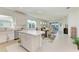Spacious kitchen with white cabinets, a large island, and stainless steel appliances at 9244 Ballaster Pointe Loop, Parrish, FL 34219