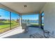 Screened-in lanai with a view of the lake at 9244 Ballaster Pointe Loop, Parrish, FL 34219
