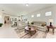 Living room with tile floors and lots of windows at 9244 Ballaster Pointe Loop, Parrish, FL 34219