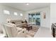 Bright living room with sliding glass doors that lead to the patio at 9244 Ballaster Pointe Loop, Parrish, FL 34219