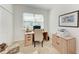 Bright home office featuring a desk, chair, closet, filing cabinet, and comfortable seating at 9244 Ballaster Pointe Loop, Parrish, FL 34219
