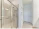 Bathroom shower with glass door, tiled walls, built-in niche, grab bar and overhead showerhead at 9244 Ballaster Pointe Loop, Parrish, FL 34219