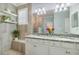 Bathroom featuring dual sinks with granite countertop, and natural accents at 10379 Medjool Dr, Venice, FL 34293