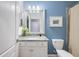 Bathroom features a granite vanity top, updated fixtures, and neutral decor at 10379 Medjool Dr, Venice, FL 34293