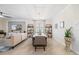 Elegant dining area adjacent to the living room, featuring a modern chandelier and stylish decor at 10379 Medjool Dr, Venice, FL 34293